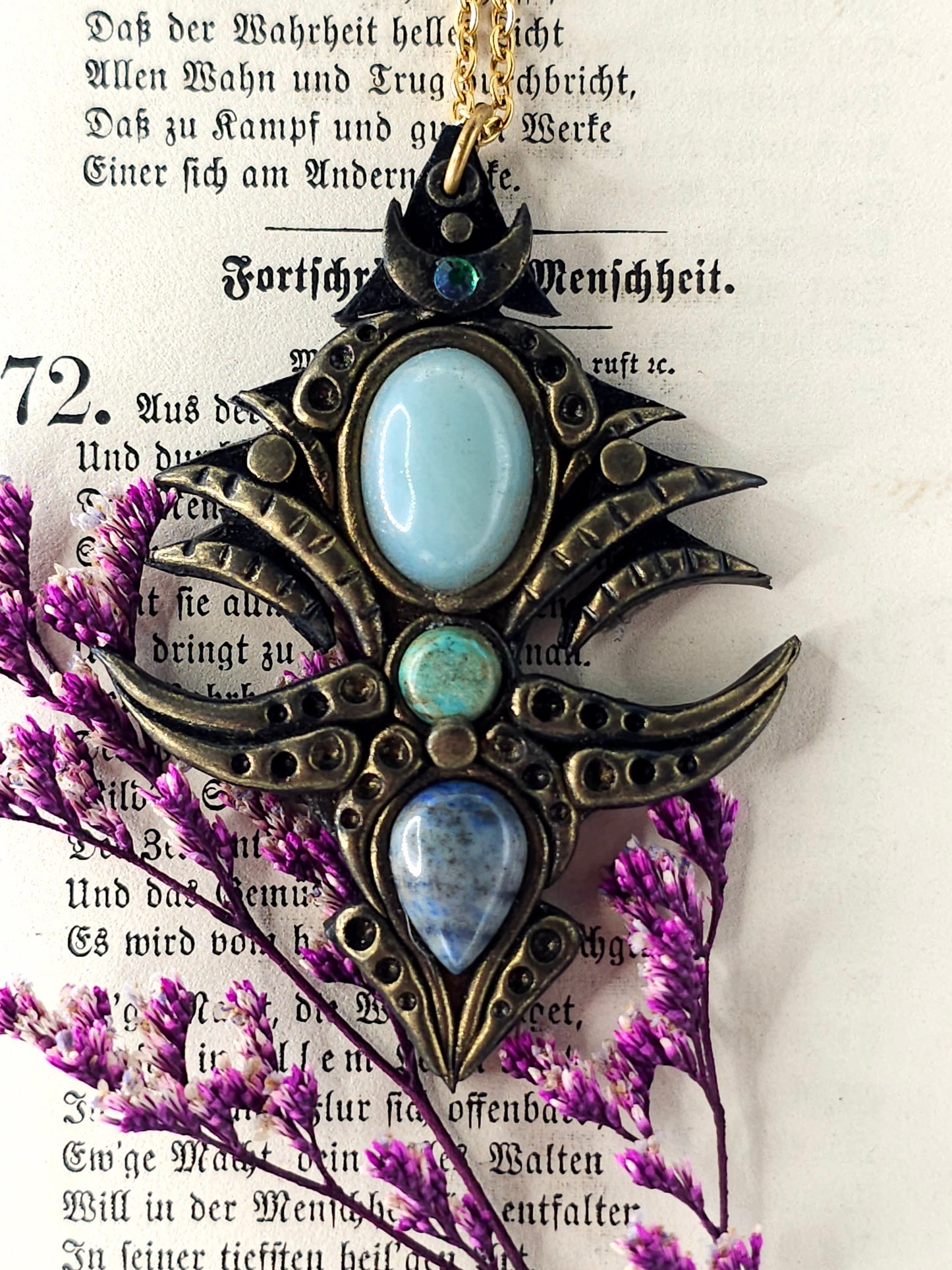 Blue gemstone tribal amulet