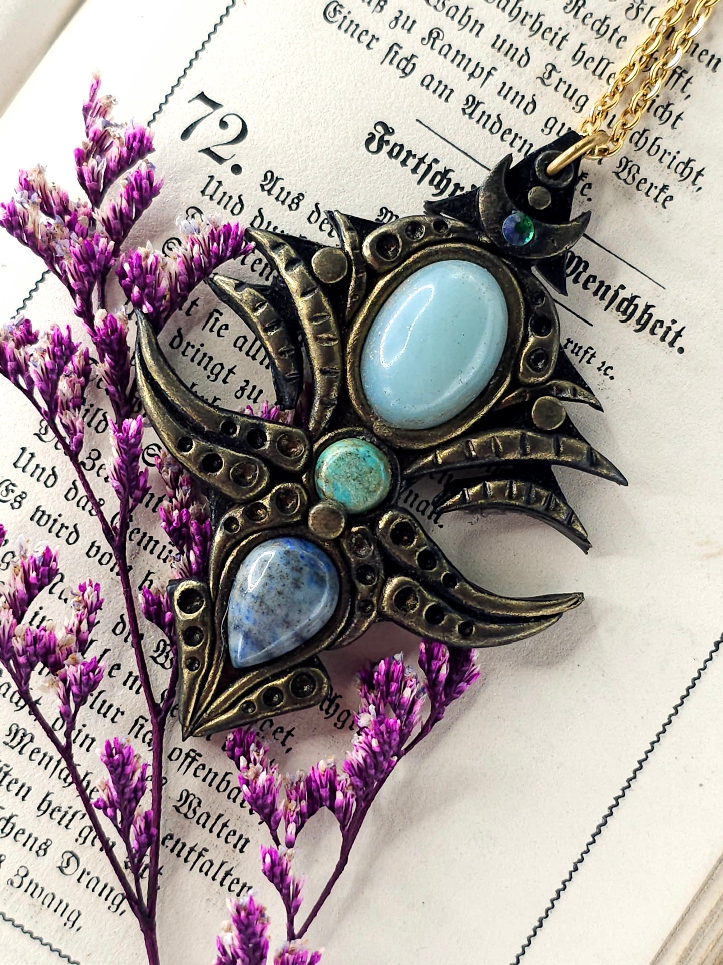 Blue gemstone tribal amulet